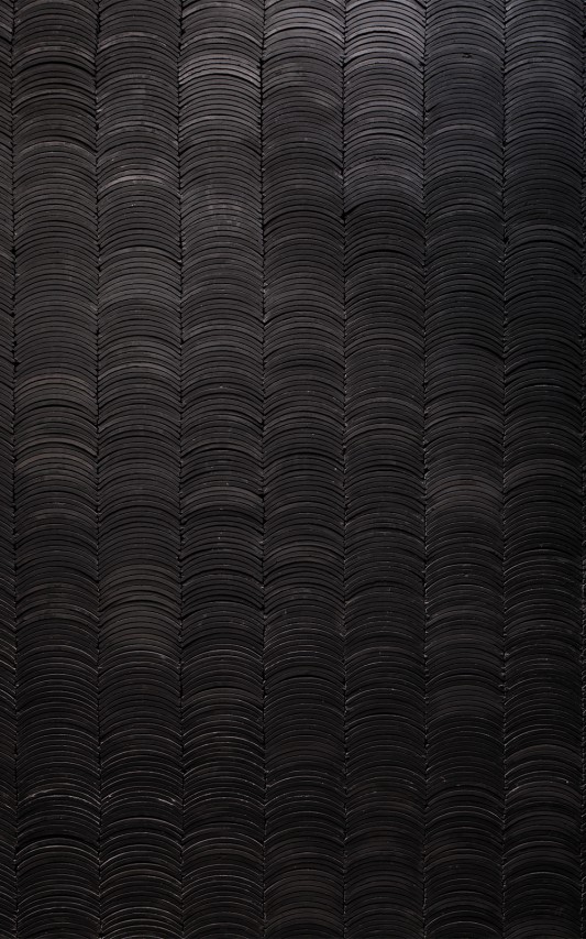 The use of the stacked roof tiles on the interior walls create the sense of a Japanese Village.