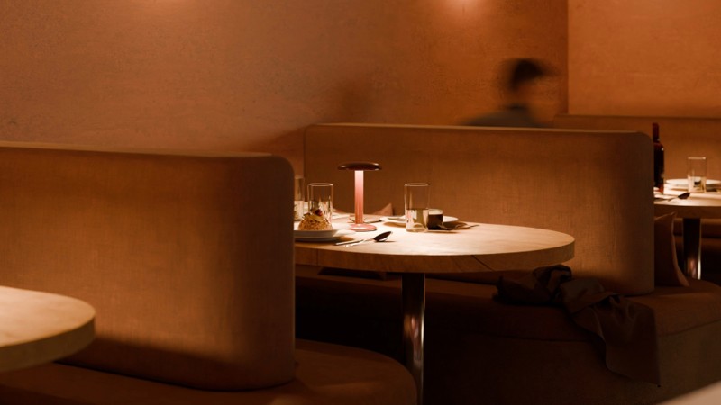 Booths are sculpted into the room like alcoves, creating intimate enclosures that encourage guests to settle in and stay awhile.