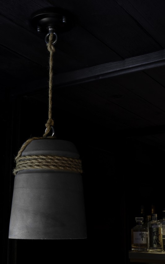 Made from concrete and rope, the selected pendants provide a rustic yet comfortable accent.